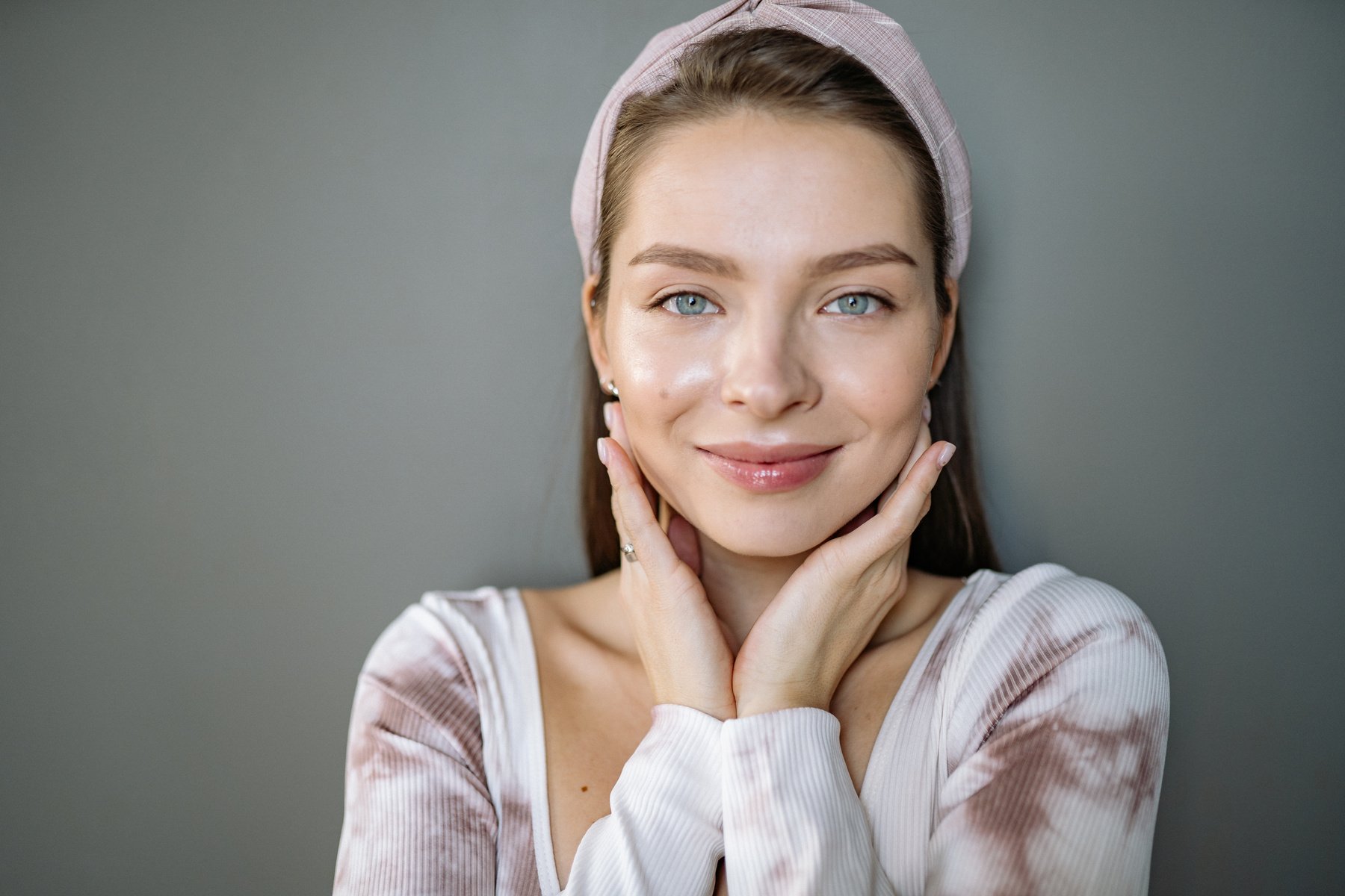 Beautiful Woman Holding Her Face